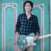 Eross Candra Gitaris Sheila On 7 saat memegang sebuah gitar Fender Telecaster limited edition miliknya