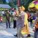 Anggota DPD RI, Syarif Mbuinga didampingi istri saat disambut adat suku Sangihe di Desa Karangetan, Kecamatan Dengilo, Pohuwato, Sabtu (8/2/2025).